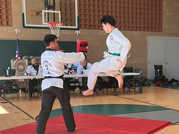 Elgin younger student jump kick